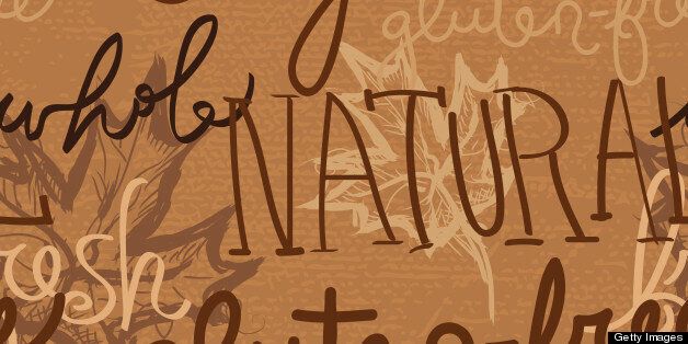 'Vector illustration of a seamless background of hand drawn words, organic, natural, gluten-free, whole,sustainable,fresh with sketchy leaves and burlap textured background.'