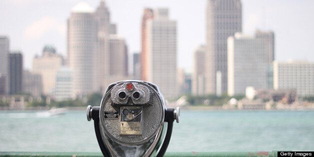 Detroit downtown high-rises as seen across Detroit River from Windsor, Ontario.Old fashioned coin operated binoculars.