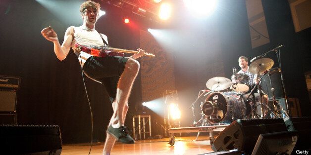 LEICESTER, UNITED KINGDOM - AUGUST 19: Brian King and David Prowse of Japandroids perform on stage during the Summer Sundae Weekender festival at De Montfort Hall And Gardens on August 19, 2012 in Leicester, United Kingdom. (Photo by Ollie Millington/Redferns via Getty Images)