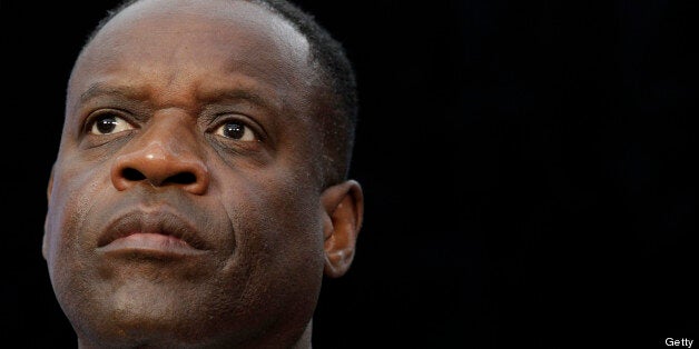 Kevyn Orr, emergency manager for the city of Detroit, listens during a news conference in Detroit, Michigan, U.S., on Friday, July 19, 2013. Detroit, the cradle of the automobile assembly line and a symbol of industrial might, filed the biggest U.S. municipal bankruptcy after decades of decline left it too poor to pay billions of dollars owed bondholders, retired cops and current city workers. Photographer: Jeff Kowalsky/Bloomberg via Getty Images 