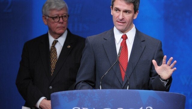 Virginia Attorney General Ken Cuccinelli (R) speaks during his acceptance of the 'Defender of the Constitution' award as National Rifle Association President David Keene (L) looks on at the 39th Conservative Political Action Committee February 9, 2012 at a hotel in Washington, DC. AFP PHOTO/Mandel NGAN (Photo credit should read MANDEL NGAN/AFP/Getty Images)