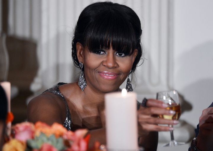 US First Lady Michelle Obama makes a toast during the 2013 Governor's Dinner in the State Dinning Room of the White House in Washington, DC, on February 24, 2013. AFP PHOTO/Jewel Samad (Photo credit should read JEWEL SAMAD/AFP/Getty Images)