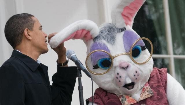 US President Barack Obama jokingly talks into the ear of a Easter Bunny after the microphones were not turned on during the annual White House Easter Egg Roll on the South Lawn of the White House in Washington, DC, on April 13, 2009. More than 30,000 guests will attend this year's events, which include a kids kitchen, an organic kitchen, live musical performances, kids yoga and the traditional Easter egg roll. AFP PHOTO / Saul LoebLoeb (Photo credit should read SAUL LOEB/AFP/Getty Images)