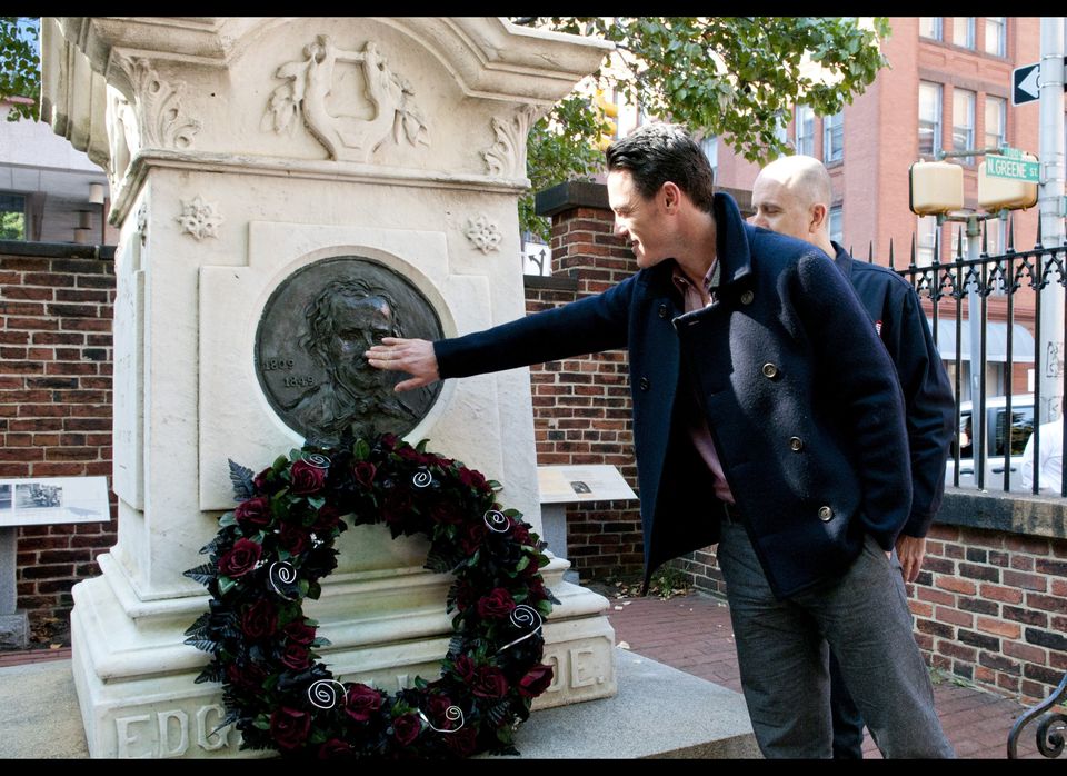 Luke Evans & James McTeigue Visit Edgar Allan Poe's Grave On The 162nd Anniversary Of His Death