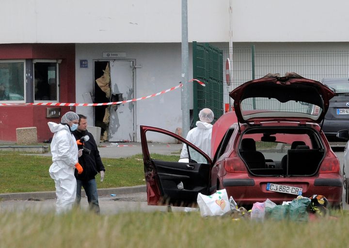 Forensics experts are at work near a door opened with explosives by an inmate, Redoine Faid, who managed to escape after holding five wardens hostages, on April 13, 2013 at Sequedin prison. AFP PHOTO FRANCOIS LO PRESTI (Photo credit should read FRANCOIS LO PRESTI/AFP/Getty Images)