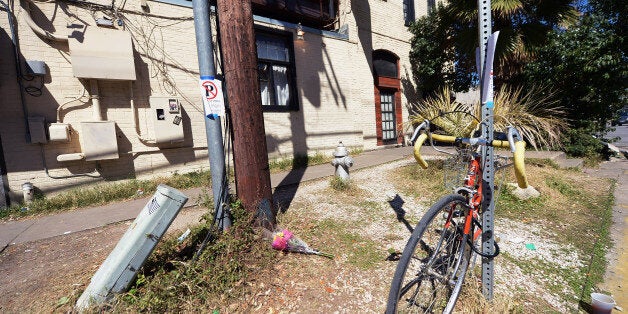 AUSTIN, TX - MARCH 13: Flowers lie on the ground near the scene of a deadly car accident at the South by Southwest Music, Fi