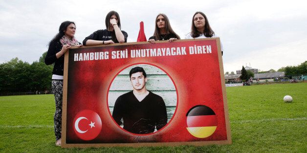 HAMBURG, GERMANY - APRIL 30: Team-mates, friends and relatives gather to remember Diren Dede at his football club, SC Teutonia 1910, on April 30, 2014 in Hamburg, Germany. German student Diren, 17, was fatally shot in the head and arm when he entered the garage of Markus Kaarma in Missoula, Montana, United States, early on Sunday, April 27th. Diren, an 11th grader, was on a one-year high school exchange program in Missoula and was scheduled to soon return to his native city of Hamburg. (Photo by Oliver Hardt/Getty Images)
