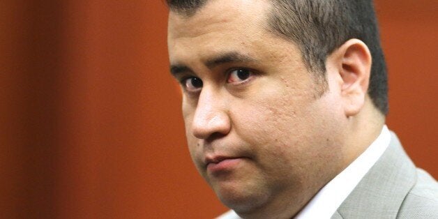 FILE - In this July 9, 2013 file photo, George Zimmerman leaves the courtroom for a lunch break in his trial in Seminole Circuit Court, in Sanford, Fla. A prosecutor in Orlando, Fla., on Thursday, June 18, 2105, upgraded the charge against Matthew Apperson to second-degree murder. Apperson is accused of shooting into George Zimmerman's vehicle while they were driving down a busy road last month. (Joe Burbank/Orlando Sentinel via AP, Pool, File)