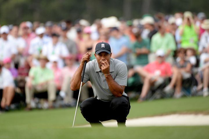 AUGUSTA, GA - APRIL 11: Tiger Woods of the United States lines up a putt on the 17th green during the first round of the 2013 Masters Tournament at Augusta National Golf Club on April 11, 2013 in Augusta, Georgia. (Photo by Harry How/Getty Images)
