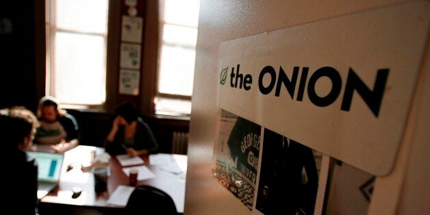Editors and writers work on copy during a drafts meeting at The Onion offices in New York, Thursday, Oct. 30, 2008. (AP Phot