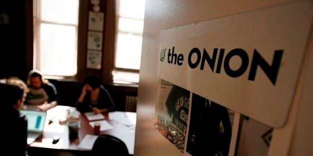 Editors and writers work on copy during a drafts meeting at The Onion offices in New York, Thursday, Oct. 30, 2008. (AP Photo/Seth Wenig)