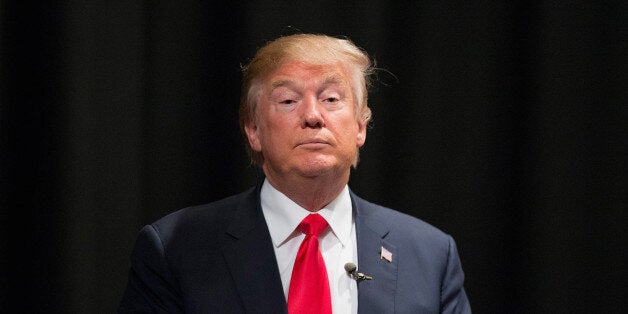 NEWTON, IA - NOVEMBER 19: Republican presidential candidate Donald Trump speaks to guests following a town hall meeting at Des Moines Area Community College Newton Campus on November 19, 2015 in Newton, Iowa. Trump is currently leading the race for the Republican presidential nomination in Iowa. (Photo by Scott Olson/Getty Images)