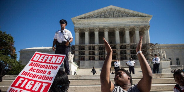 WASHINGTON, DC - OCTOBER 15: Students protest in support of affirmative action, outside the Supreme Court during the hearing of 'Schuette v. Coalition to Defend Affirmative Action' on October 15, 2013 in Washington, DC. The case revolves around affirmative action and whether or not states have the right to ban schools from using race as a consideration in school admissions. (Photo by Andrew Burton/Getty Images)