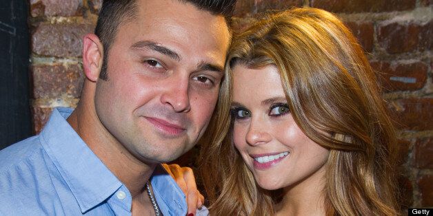 NEW YORK, NY - AUGUST 22: New York Yankees player Nick Swisher (L) and actress Joanna Garcia Swisher attend the Yankees Unite for Tornado Relief benefit at Southern Hospitality on August 22, 2011 in New York City. (Photo by Michael Stewart/WireImage)