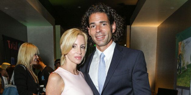 HOLLYWOOD, CA - SEPTEMBER 20: Tv Personality Camille Grammer and boyfriend Dimitri Charalambopoulos attend the GBK Productions Luxury Lounge during Emmy's Weekend on September 20, 2013 in Hollywood, California. (Photo by Tiffany Rose/WireImage)