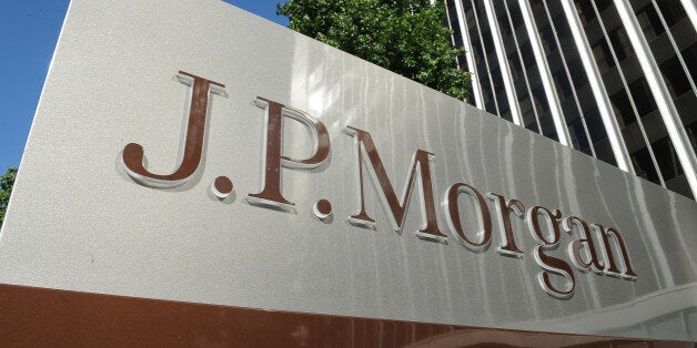 A JPMorgan sign is seen outside the office tower housing the financial services firm's Los Angeles, California offices, August 8, 2013. US banking giant JPMorgan Chase said August 8, 2013 it is facing parallel civil and criminal investigations over its sale of mortgage-backed securities before the financial crisis. JPMorgan disclosed in a securities filing that in May it was notified by the civil division of the US Attorneys Office for the Eastern District of California stating that it had preliminarily concluded that the bank 'violated certain federal securities laws' in connection with the subprime mortgage-backed securities. AFP PHOTO / Robyn Beck (Photo credit should read ROBYN BECK/AFP/Getty Images)