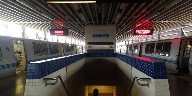 Two BART trains pulling into MacArthur station in Oakland, California.