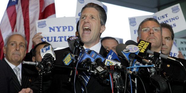Patrick Lynch, head of the PBA speaks at a news conference in support of the police officers indicted in a ticket-fixing scandal at the Bronx Supreme Court Friday, Oct. 28, 2011 in New York. In total, 16 officers were arraigned in a packed courtroom. The halls were swarmed with people, and hundreds of officers carrying signs stood outside the courthouse and applauded as the accused officers walked through. (AP Photo/David Karp)