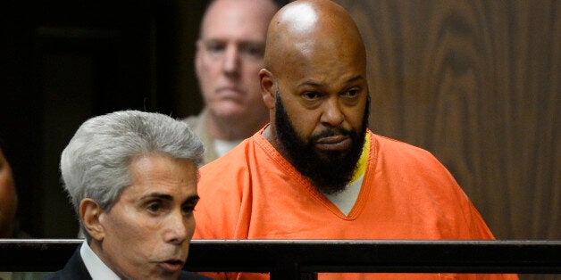 FILE - In this Tuesday, Feb. 3, 2015, file photo, Marion "Suge" Knight, right, is joined by his attorney David Kenner, left,