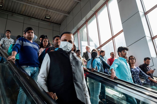 A commuter wearing a face mask as a preventive measure against the spread of the COVID-19 coronavirus...