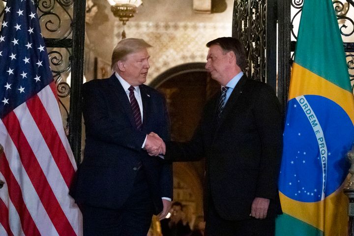 President Donald Trump shakes hands before a dinner with Brazilian President Jair Bolsonaro at Mar-a-Lago on March 7, 2020, in Palm Beach, Florida.