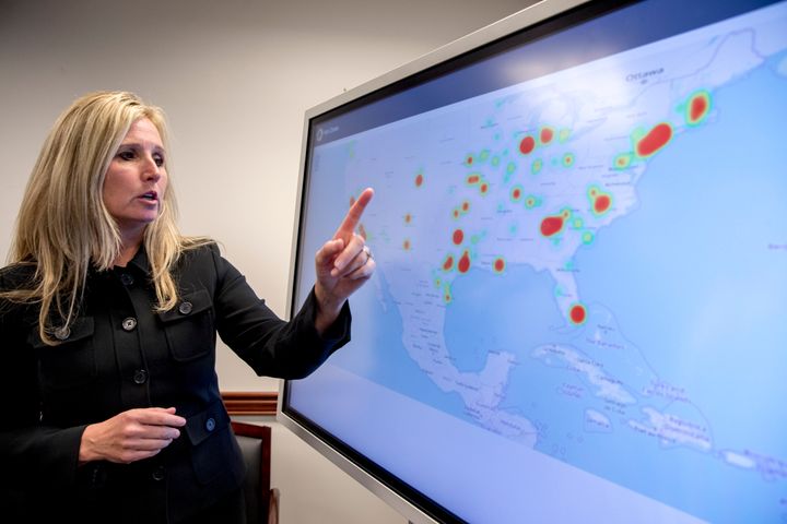 Wendy Woolcok, the special agent in charge of the DEA's special operations division, points to a monitor displaying the locales of arrests.