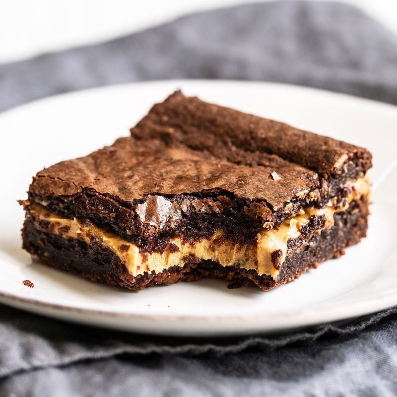 Get the Peanut Butter Stuffed Brownies recipe from Handle the Heat &nbsp;