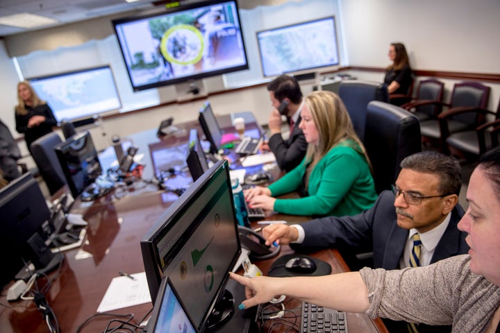 Drug Enforcement Administration agents and intelligence analysts gather information from field operations across the country