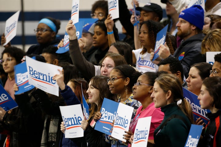 Supporters of Democratic presidential candidate Sen. Bernie Sanders (I-Vt.) hold signs as they listen during a campaign rally in Virginia Beach, Virginia.