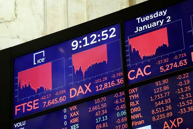 Electronic screens display readings for the FTSE, DAX and CAC at the New York Stock Exchange.