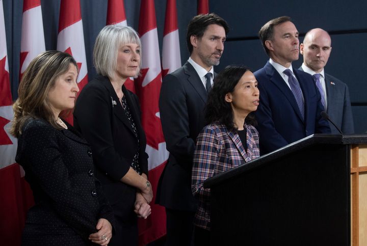 Deputy Prime Minister and Minister of Intergovernmental Affairs Chrystia Freeland, Minister of Health Patty Hajdu Prime Minister Justin Trudeau, Minister of Finance Bill Morneau and Treasury Board President Jean-Yves Duclos look on as Chief Medical Officer Theresa Tam speaks during a news conference on the coronavirus situation in Ottawa on March 11, 2020.