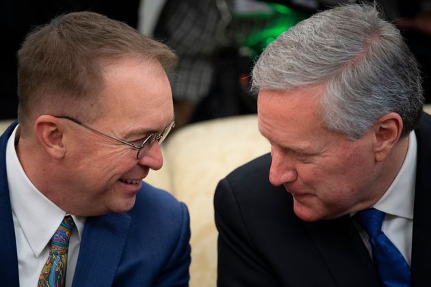 Mark Meadows, seen here with outgoing White House chief of staff Mick Mulvaney (left), also had contact with the same person as Collins and Gaetz. Meadows, who is replacing Mulvaney, briefly self-quarantined but tested negative for coronavirus.