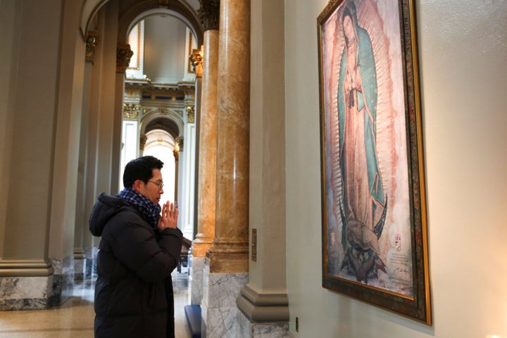 Jun Lee, a Catholic from South Korea, prays during a visit to St. James Cathedral, which is only open for prayer after the Archdiocese of Seattle canceled all public celebration of Mass at all parishes due to the coronavirus in Seattle, Washington, on March 12.