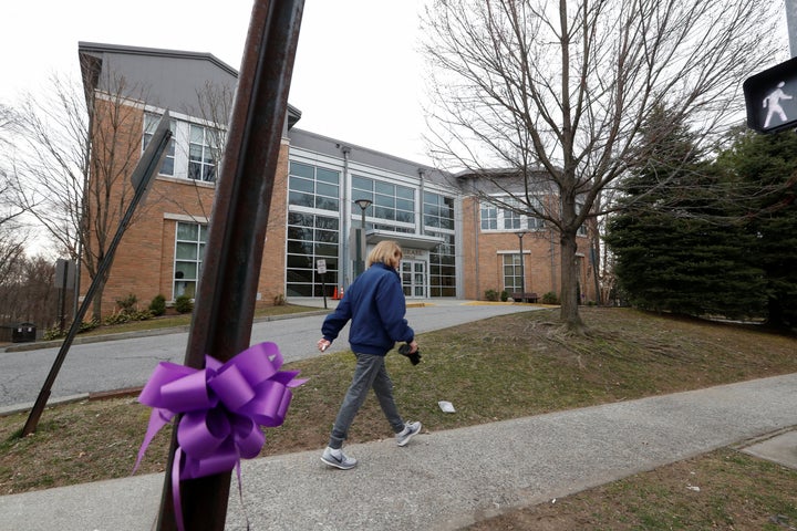 A woman walks past the Young Israel orthodox synagogue during the coronavirus outbreak in New Rochelle, New York, on March 12.