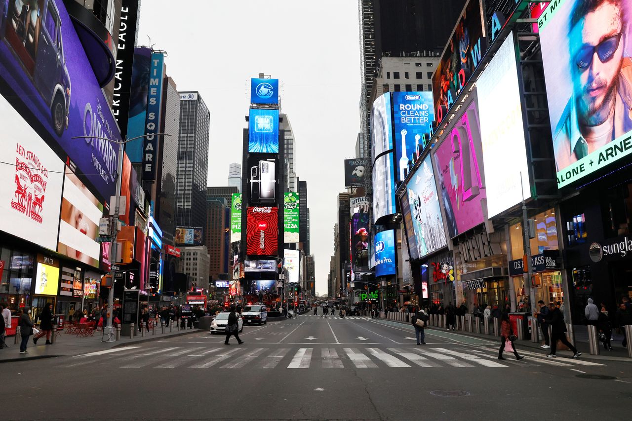 A nearly empty 7th Avenue in Times Square is seen at rush hour after it was announced that Broadway shows will cancel performances.