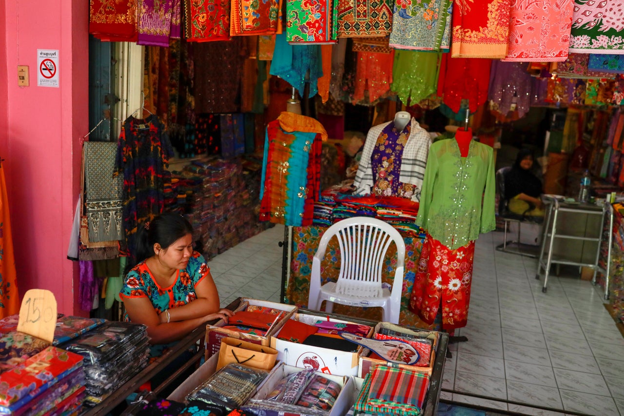 A vendor waits for customers at an empty tourist area, due to fear of the coronavirus in Phuket, Thailand.