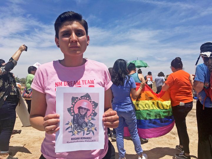 In this 2018 file photo, Gabriela Hernandez, executive director of the nonprofit New Mexico Dream Team, holds up a photo of Roxsana Hernandez, a Honduran transgender woman who died while in U.S. custody. 