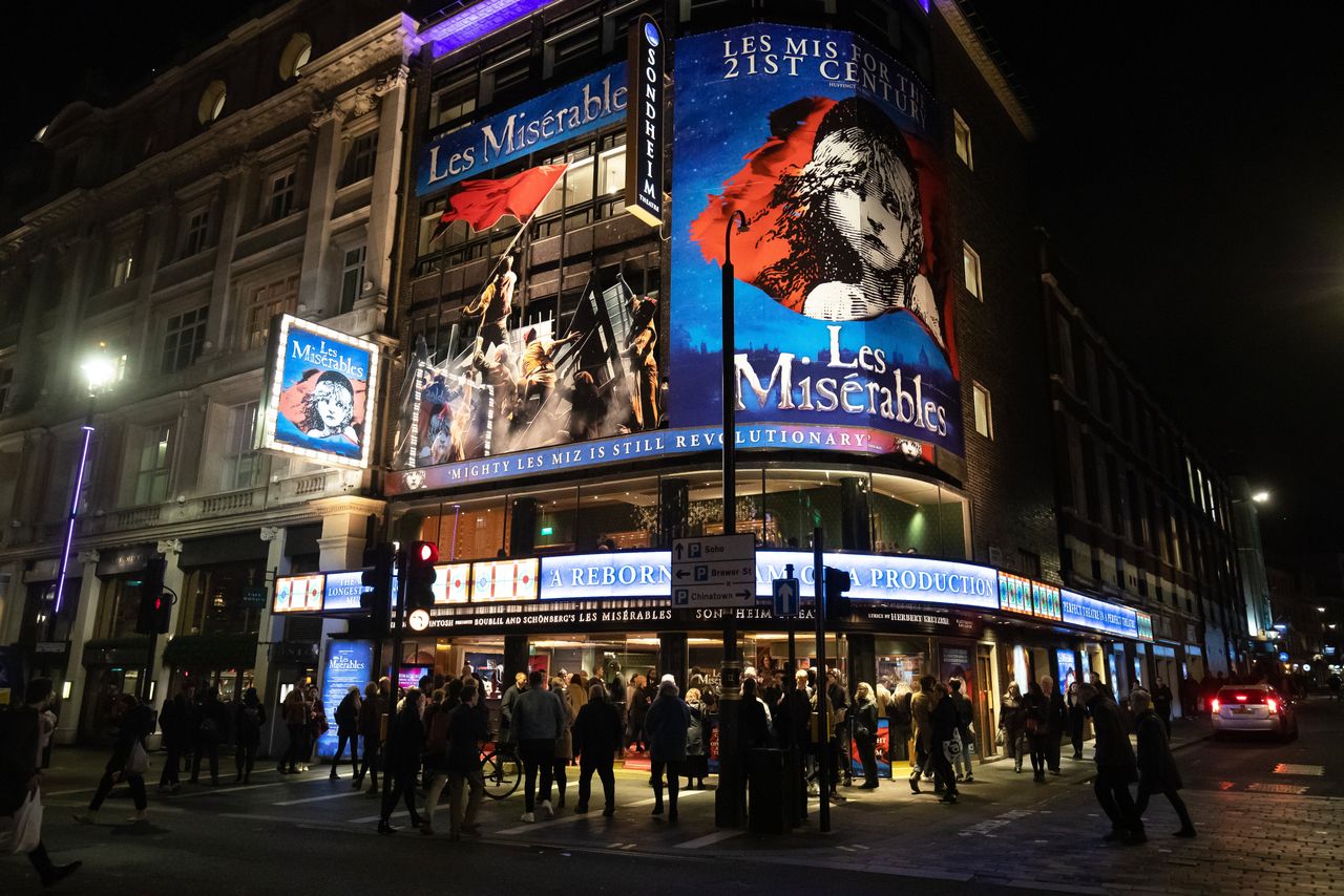 Crowds gather in outside a theatre ahead of a West End performance of Les Miserables.