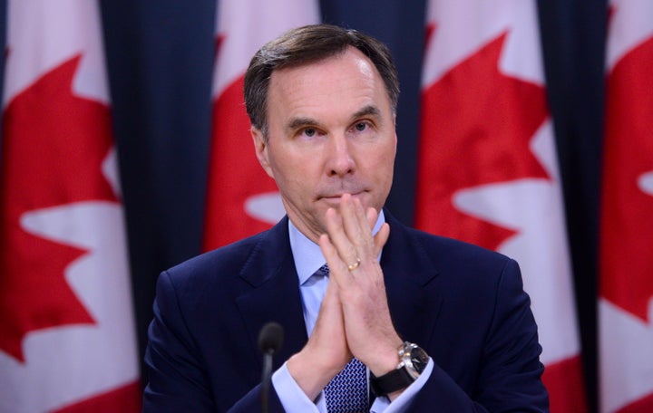 Finance Minister Bill Morneau takes part in a press conference at the National Press Theatre in Ottawa on March 13, 2020.