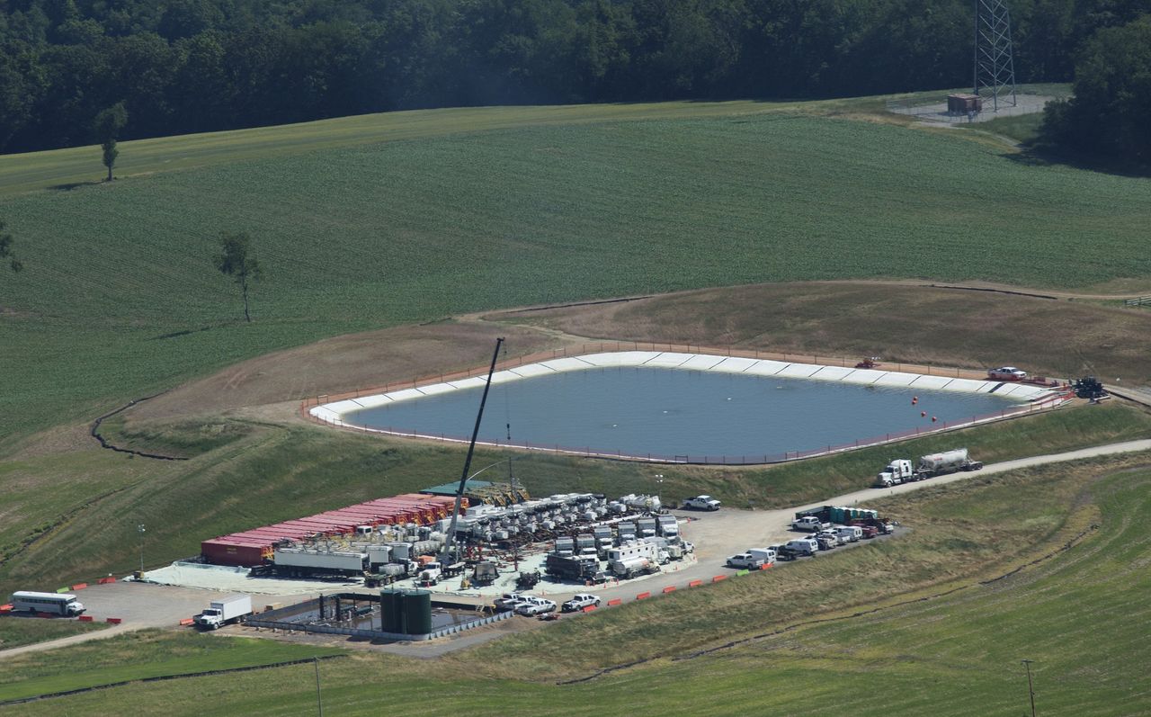A pit containing fresh water or fresh water with chemicals sits next to a drill site in Butler County, Penn. 