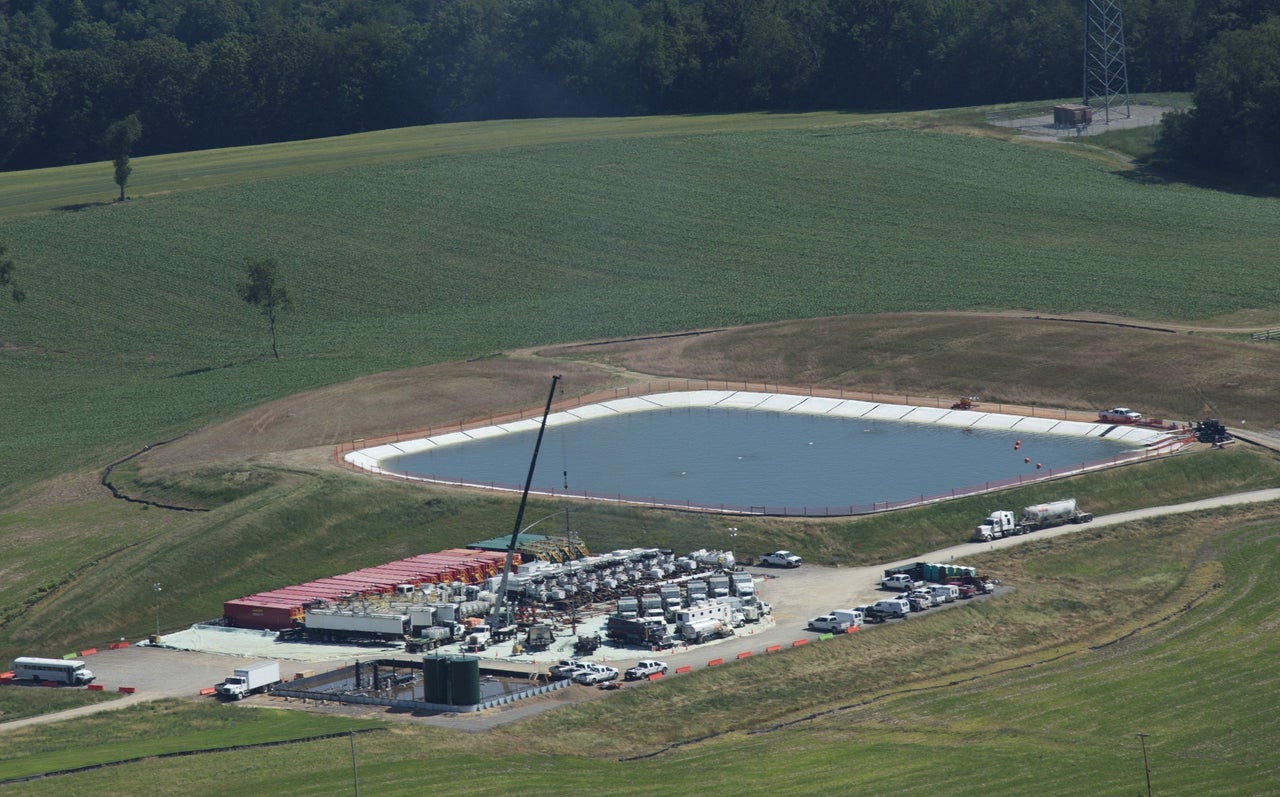 A pit containing fresh water or fresh water with chemicals sits next to a drill site in Butler County, Penn.