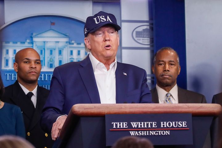 President Donald Trump speaks during a briefing on coronavirus in the Brady press briefing room at the White House, Saturday, March 14, 2020, in Washington, as U.S. Surgeon General Jerome Adams and Housing and Urban Development Secretary Ben Carson, listen. (AP Photo/Alex Brandon)