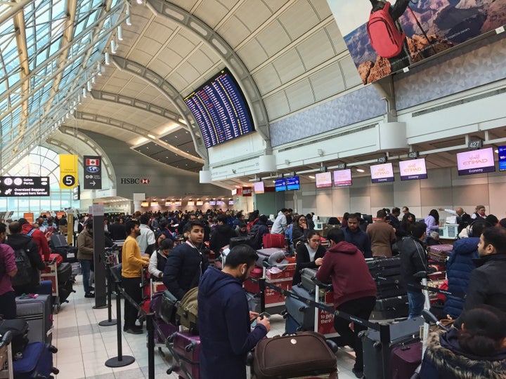 A crowd of passengers are shown at Pearson International Airport in Toronto in an undated photo.