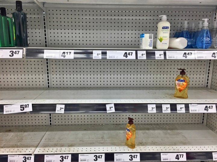 Nearly empty shelves containing hand soap at a grocery store on March 13 in Toronto.