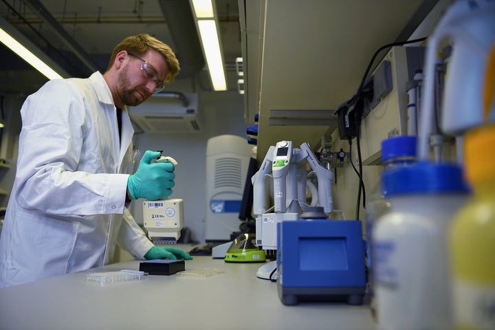 Employee Philipp Hoffmann, of German biopharmaceutical company CureVac, demonstrates research workflow on a vaccine for the coronavirus (COVID-19) disease at a laboratory in Tuebingen, Germany, March 12, 2020. (REUTERS/Andreas Gebert)