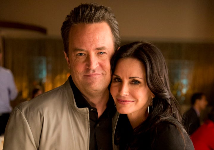 Matthew Perry and Courteney Cox pictured together on the set of "Go On." 