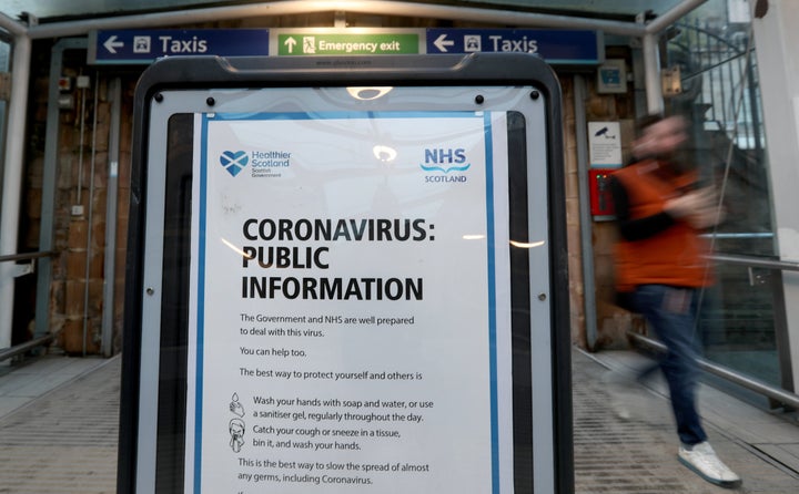 <strong>A coronavirus warning board at the entrance to Edinburgh Waverley train station. </strong>