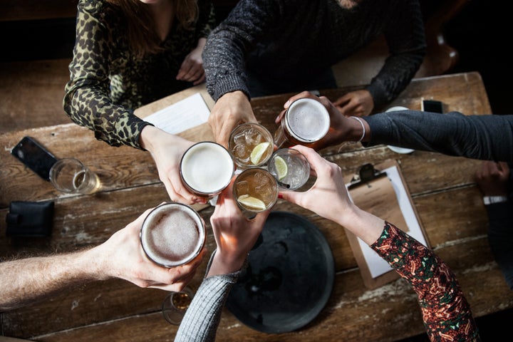 friends at a pub toasting, having a good time, birds view