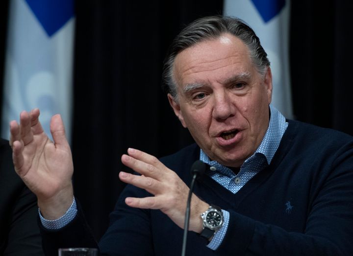 Quebec Premier Francois Legault responds to reporters questions as the government announces measures against COVID-19 on Saturday.