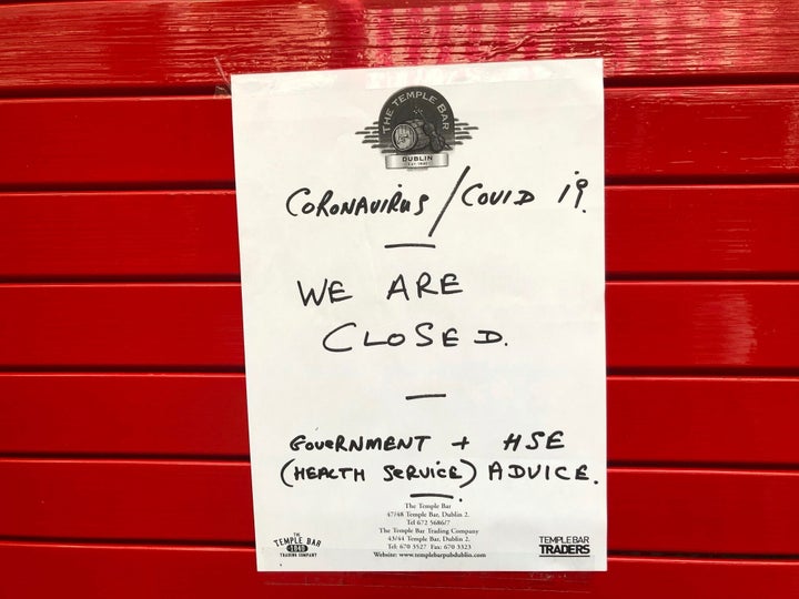 A sign on the door of The Temple Bar announces its closure amid coronavirus fears, in Dublin, Ireland, on Sunday.